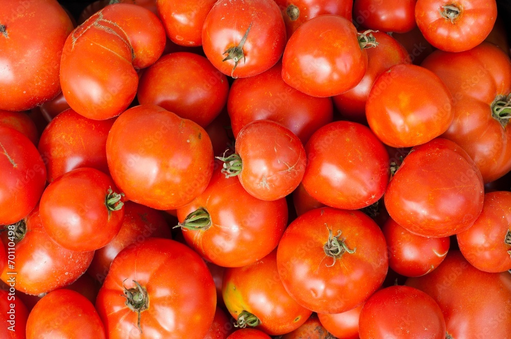 Background with fresh, ripe, red tomatoes in market