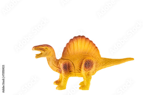 Plastic dinosaur isolated on white background photo