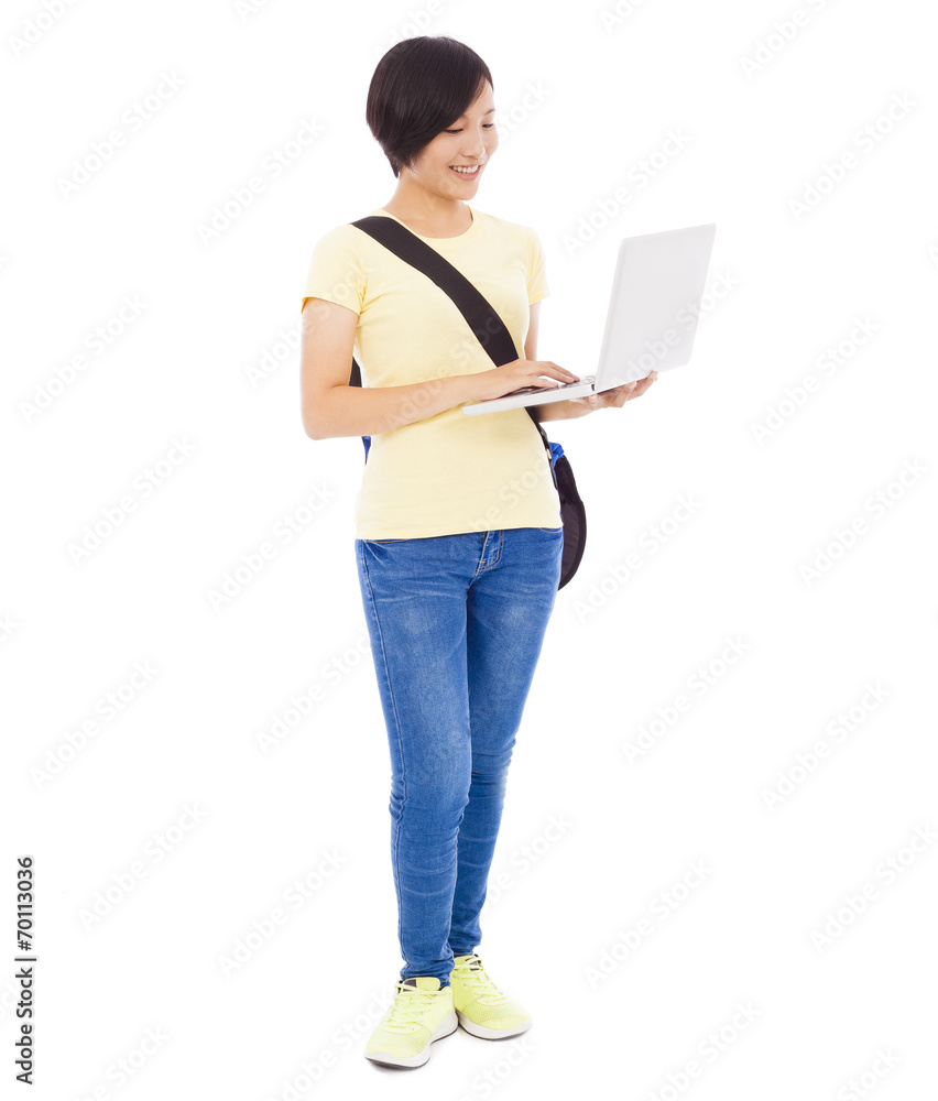 young student girl standing and holding a laptop young student girl standing and holding a laptop