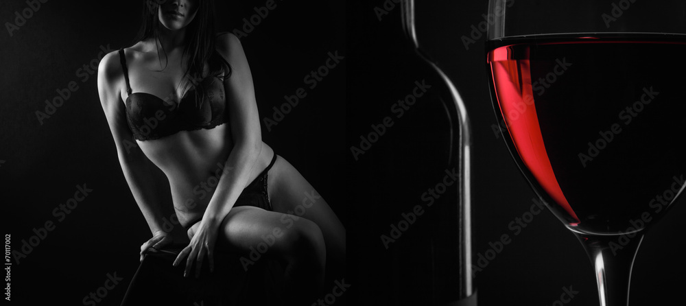 Fototapeta premium Beautiful silhouette of a female body and a glass of red wine