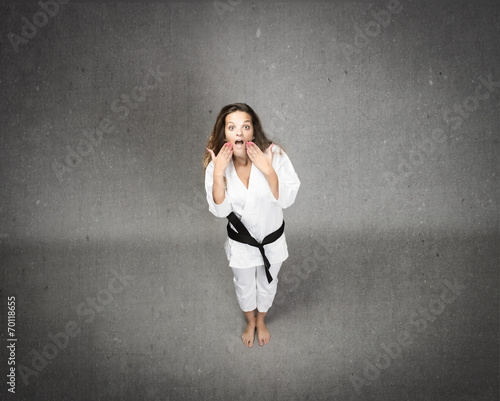 girl with unbelievable expression and karate uniform © Garrincha