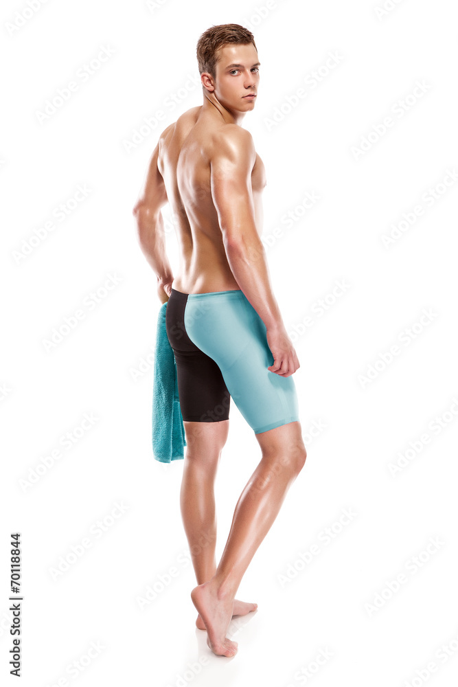 Young attractive caucasian man swimmer with goggles and towel Young attractive caucasian man swimmer with goggles and towel