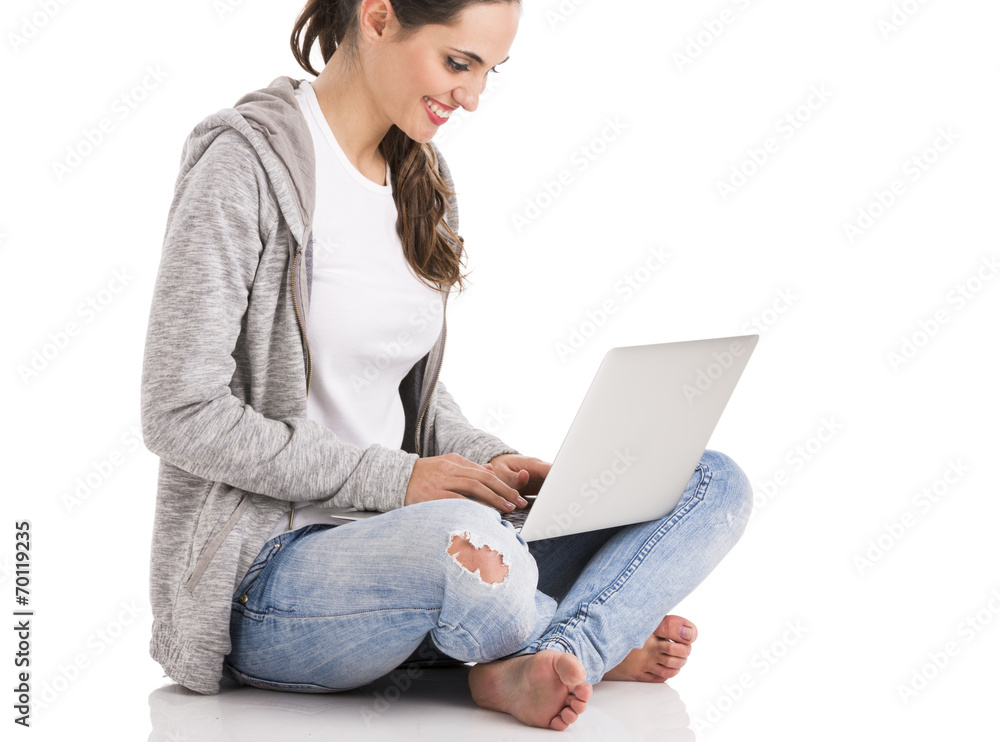 Naklejka premium Female student with a laptop