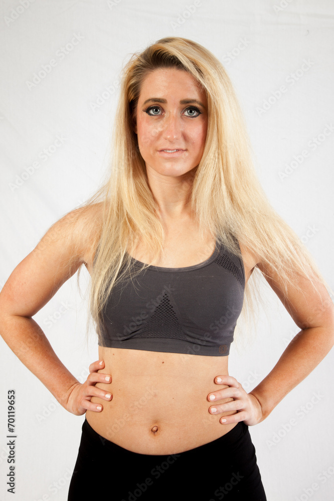 Blond woman in exercise outfit looking at the camera Blond woman in exercise outfit looking at the camera