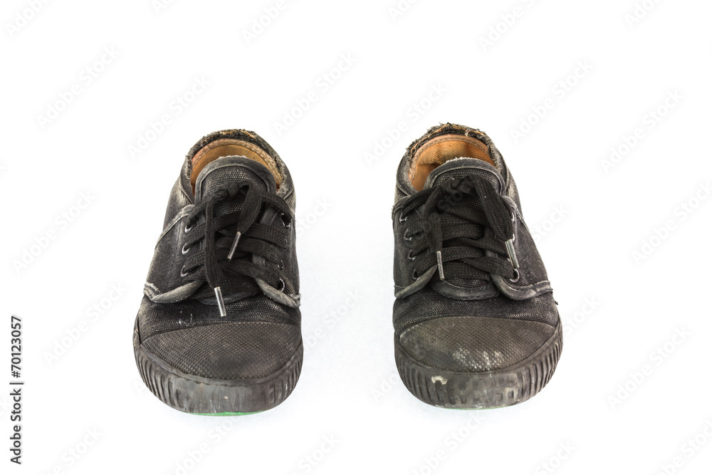 Old children sneakers on white background Old children sneakers on white background