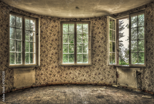 Dilapidated living room in an abandoned house