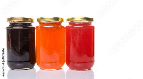 Blueberry, strawberry and orange fruit open lid bottled jam 