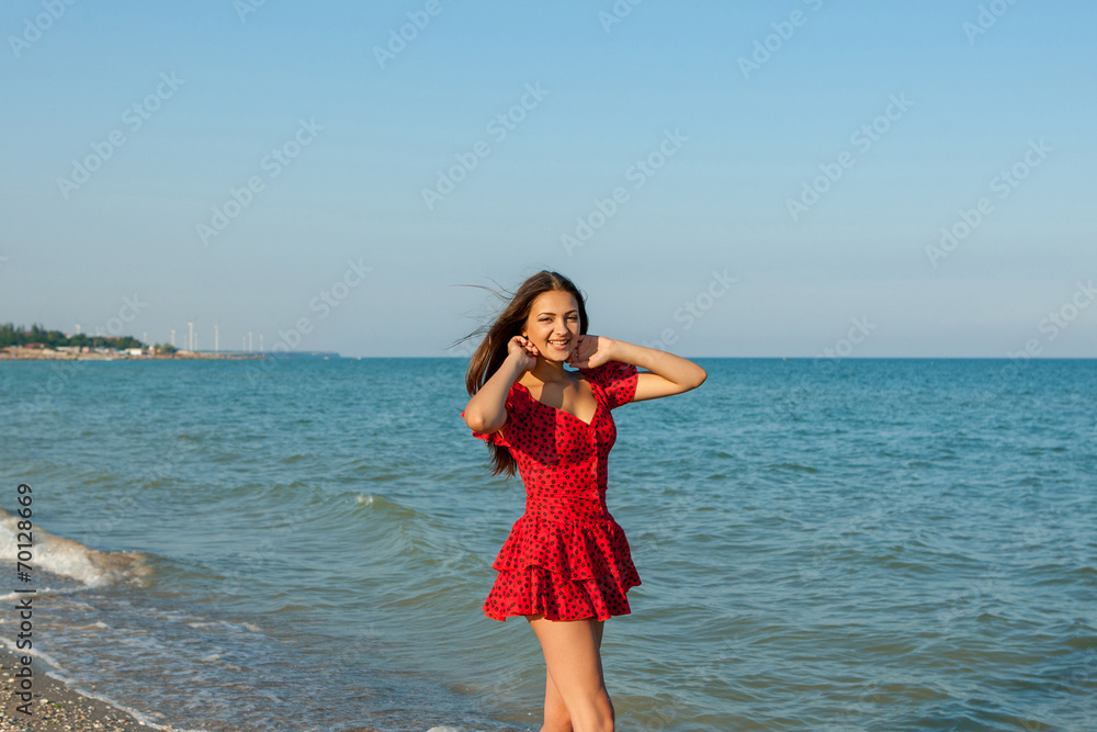 Young happiness woman on the sea