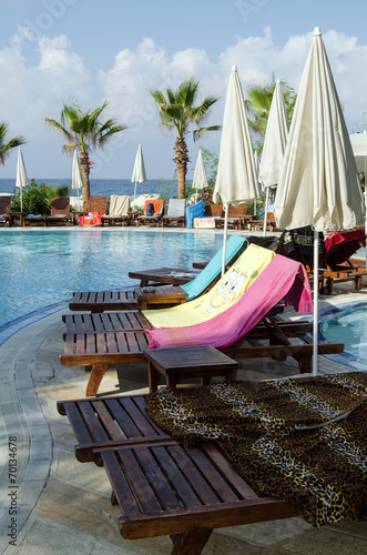 Sunloungers being reserved with towels