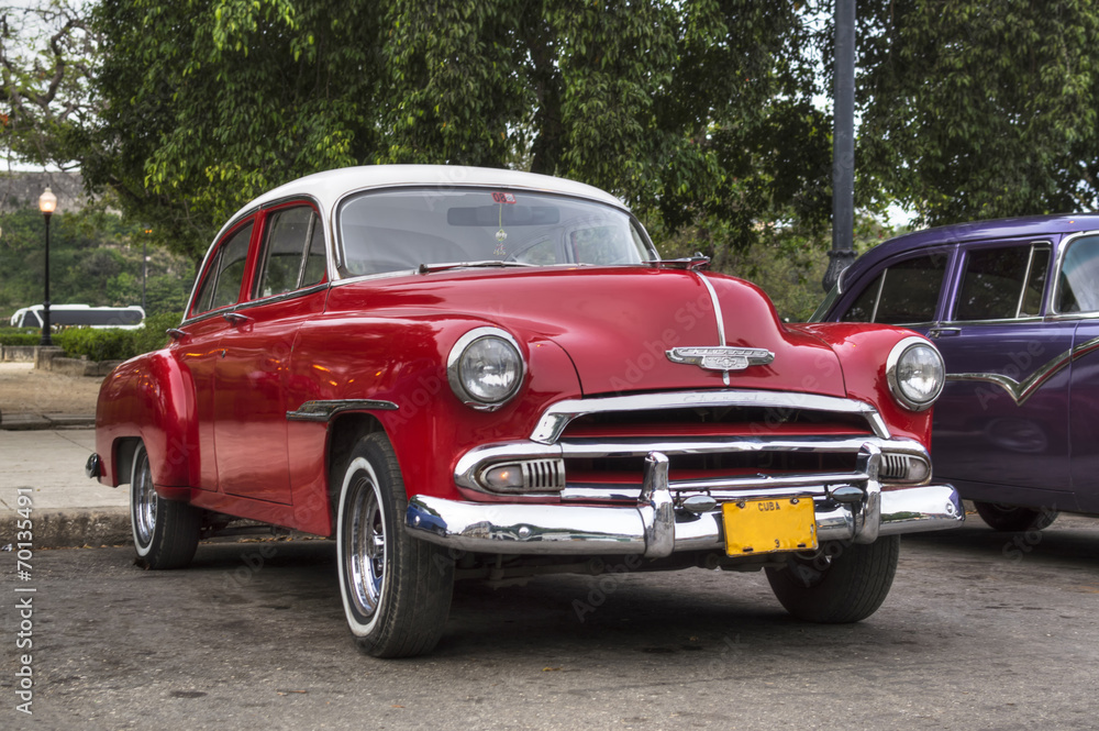 Classic red american car in Havana, Cuba