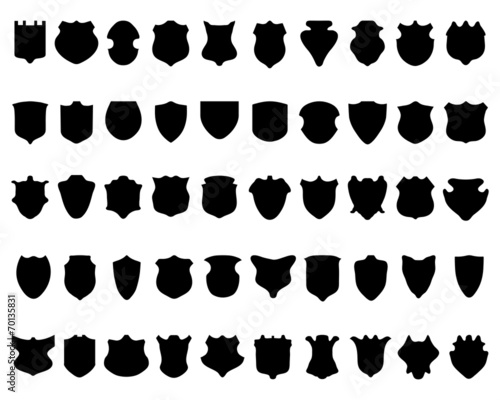 Black silhouettes of shields on white a background, vector
