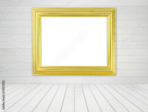 blank golden frame in room with white wood wall and wood floor