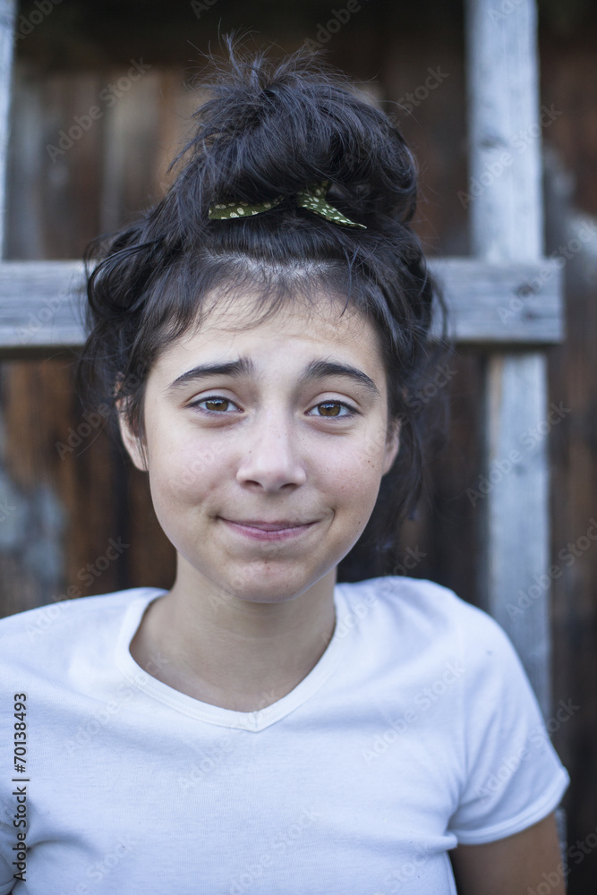 Funny girl teenager portrait in the village outdoors. Funny girl teenager portrait in the village outdoors.