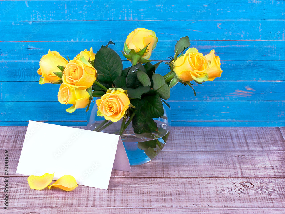 Roses in a vase and a postcard with space for text - obrazy, fototapety, plakaty 