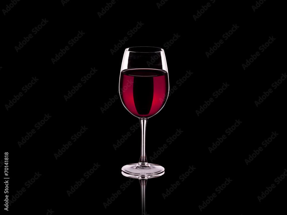 Glass of wine isolated on a black background Glass of wine isolated on a black background