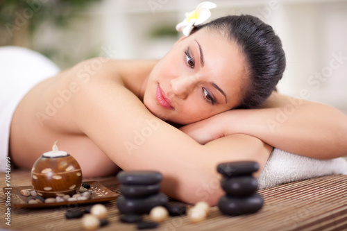 beautiful woman relaxing in spa center