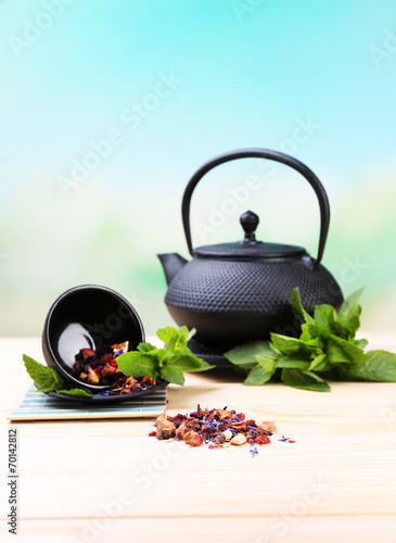 Chinese traditional teapot with fresh mint leaves and dried