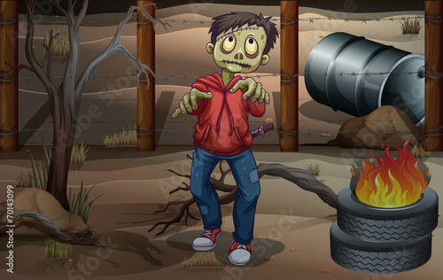 A zombie near the burning tires