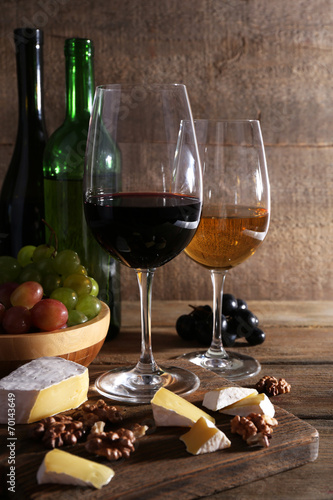 beautiful still life with wine  cheese and ripe grape