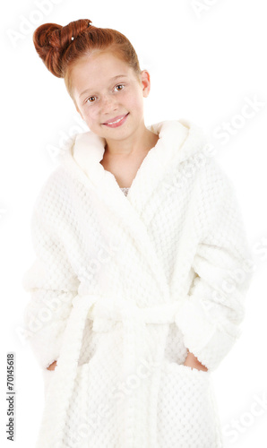 Beautiful little girl in bathrobe isolated on white