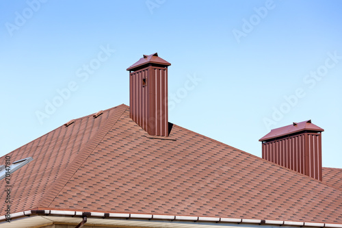 New tiled roof with chimneys