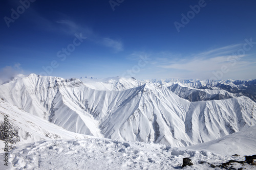 Winter snowy mountains and blue sky © BSANI