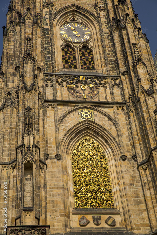front and clock on cathedral in Prague