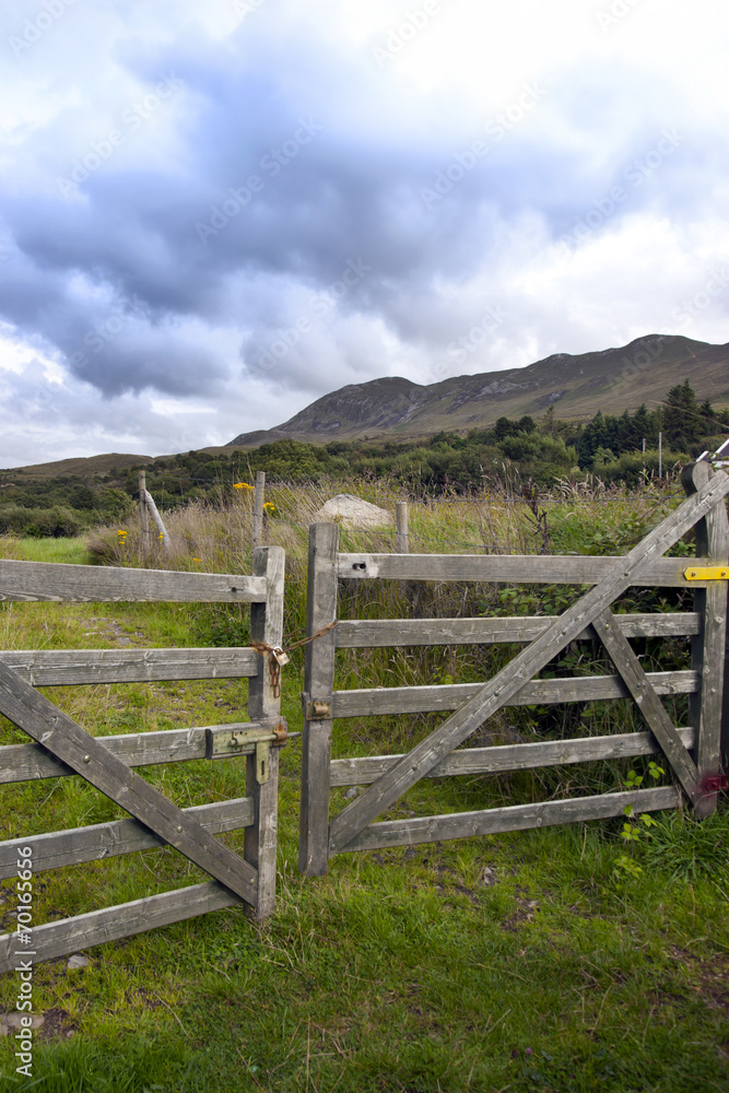 chained gate to mountains