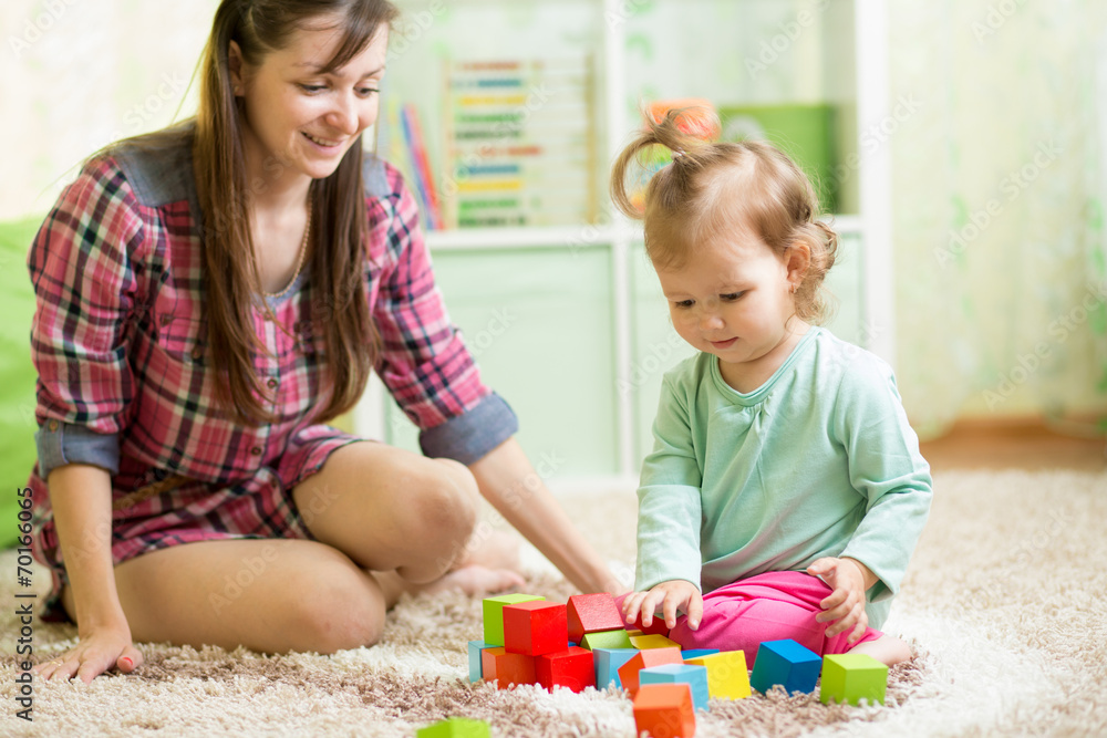 cute mother and child girl playing together indoor cute mother and child girl playing together indoor