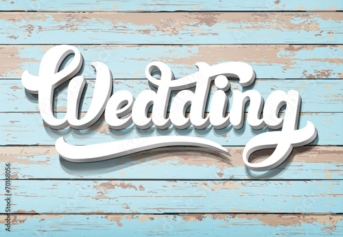 The word Wedding on a woode...