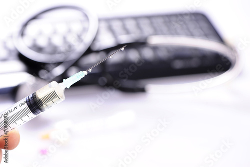 Syringe and stethoscope photo