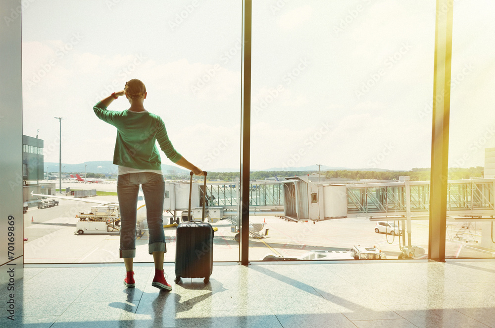 Fototapeta premium Girl at the airport window