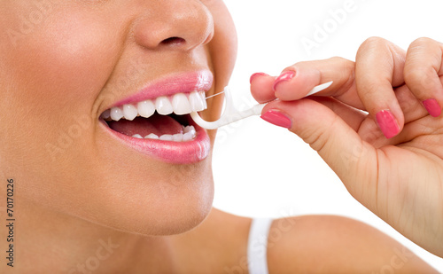 Bilde på lerret woman cleaning flossing