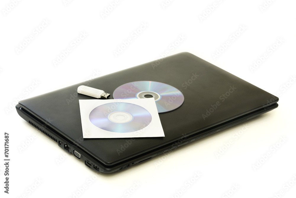 Closed black notebook and discs isolated on white Closed black notebook and discs isolated on white