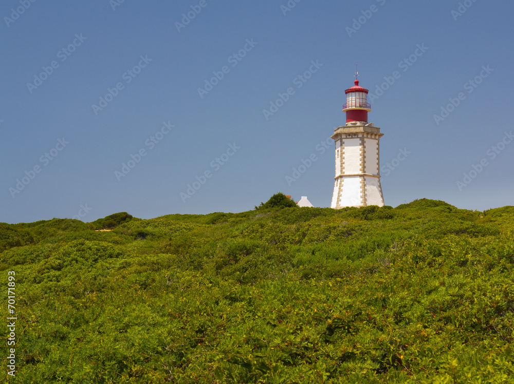 The lighthouse at Cape Espichel in Sesimbra, Setúbal, Portugal The lighthouse at Cape Espichel in Sesimbra, Setúbal, Portugal