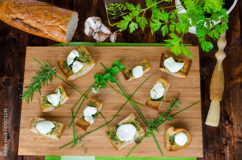 Toast with mozzarella, olive oil, herbs and garlic
