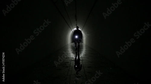 Man Silhouette in a underground bunker from cold war photo
