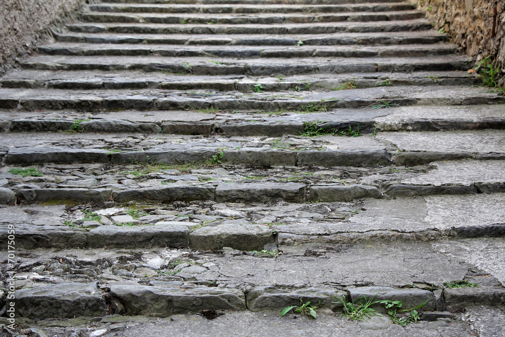 Old damaged stone staircase, up and down, textured background Old damaged stone staircase, up and down, textured background
