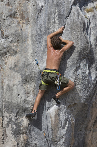 Man climbing a rock