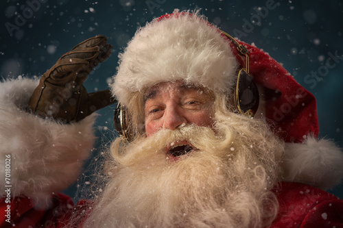 Santa Claus is listening music photo