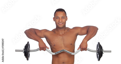 Handsome muscled man training with dumbbells