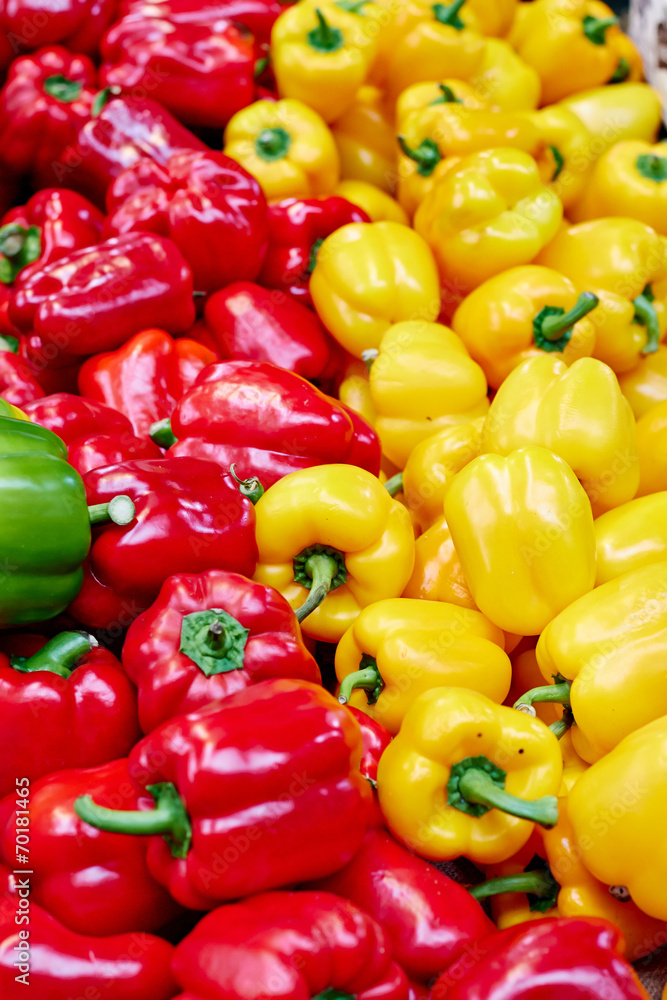Red and yellow peppers at the market Red and yellow peppers at the market