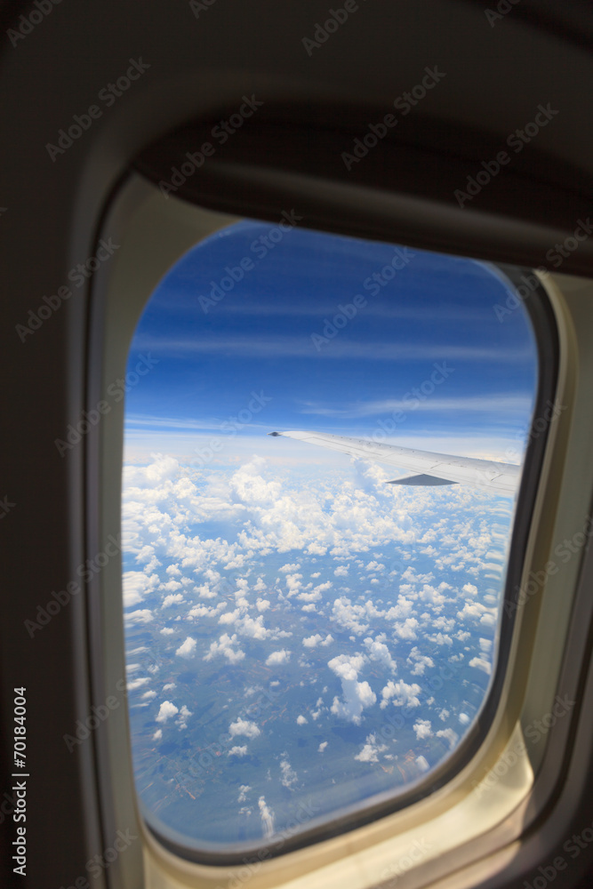 aerial view of blue sky with clouds from window of jet flight aerial view of blue sky with clouds from window of jet flight