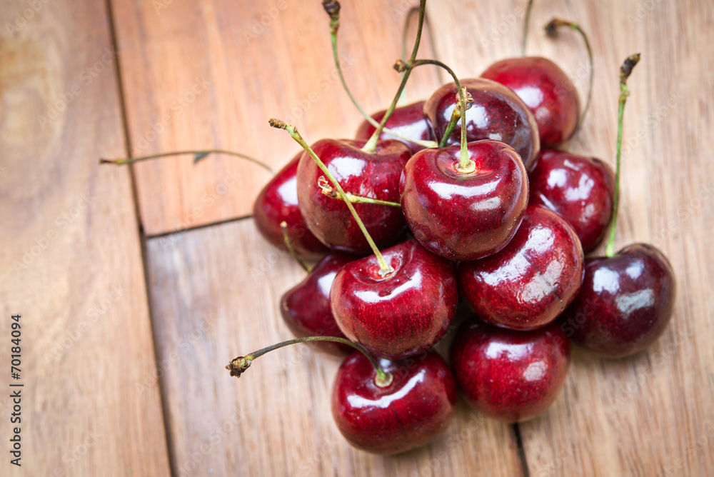 Fresh red Cherries on wooden table Fresh red Cherries on wooden table