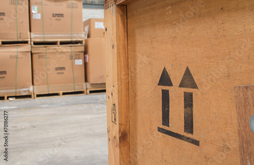 arrow up icon on wooden board  in the warehouse