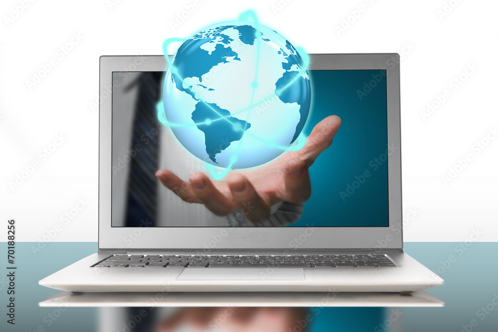 glowing orbit globe in plam through laptop glowing orbit globe in plam through laptop