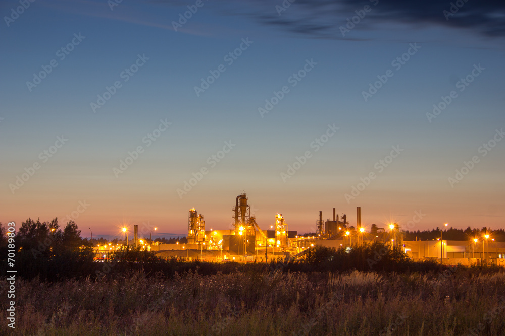 Naklejka premium Night image of timber processing plant.