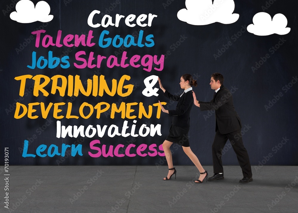 Composite image of business team standing and pushing Composite image of business team standing and pushing