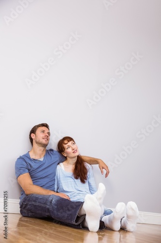 Couple sitting on floor together
