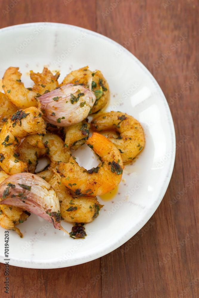 fried shrimps with garlic on plate fried shrimps with garlic on plate